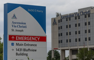 Ascension Healthcare System Employs 142,000 Ascension hospital building exterior with patients and medical staff entering the facility