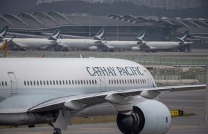 Cathay Pacific Posts HK$7 Billion 2022 Loss on China Curbs Cathay Pacific jets parked at Hong Kong gate as travel demand returns after China quarantine rules lift.