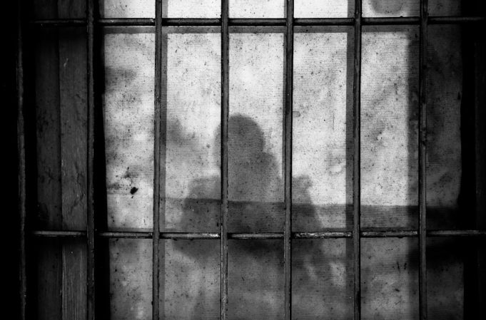Brazilian Constitution Blocked Extradition in Robinho Rape Case Robinho in a Brazilian courtroom during a hearing, surrounded by security personnel and legal representatives.