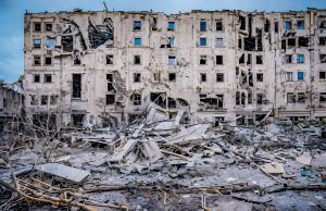 Central Russia Storm Kills 10, Injures 76 Rescue workers navigate flooded streets and debris after a severe storm hit central Russia, damaging buildings and infrastructure.