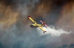 Fort McMurray Evacuates 6,000 as Wildfire Returns Aerial view of a wildfire approaching the outskirts of Fort McMurray, with smoke plumes rising above the boreal forest.