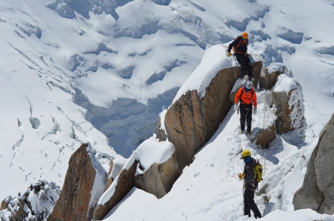 Three Italian Hikers' Deaths on Mont Blanc Prompt Safety Questions in Italy Rescue helicopter hovers above Mont Blanc's snow-covered ridge as climbers traverse the steep alpine slope under clear summer sky