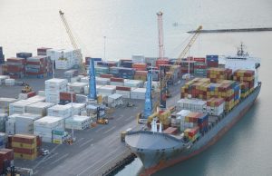 Yemen Coast Guard Intercepts Iranian Arms Shipment Yemeni patrol vessel escorts seized Iranian weapons crates aboard deck under Red Sea sunset