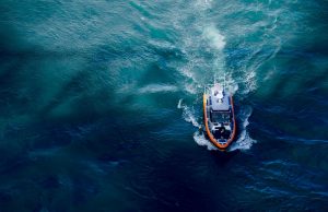 Mallorca Shipwreck Kills 1, Injures 19 Migrants Rescue workers pull an injured migrant from a drifting boat off the coast of Mallorca.