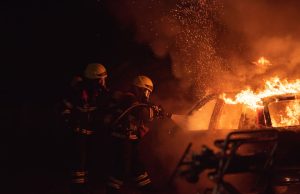 Neuves-Maisons Fire Exposes Emergency Response Gaps Firefighters at a burning residential house in Neuves-Maisons with emergency vehicles and ladder trucks on scene.