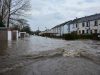 Angola Storm Kills 15 as Luanda Drainage Fails Flooded streets in Luanda, Angola, with submerged vehicles and debris after heavy rain overwhelmed drainage infrastructure.
