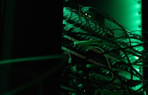 Amazon Invests $4B in Anthropic AI Startup Amazon Web Services logo next to Anthropic logo on a digital interface representing cloud computing partnership.