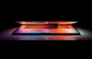 DeepMind FunSearch AI Makes Original Math Discovery A computer screen displays code generated by DeepMind's FunSearch AI, with mathematical formulas and graphs in the background.
