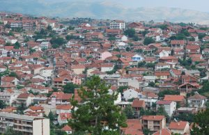 North Macedonia Nightclub Fire Kills 59 Emergency responders and firefighters work at the scene of a nightclub fire in Kočani, North Macedonia, with smoke rising from the damaged building.