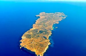 26 Migrants Die as Boat Capsizes Off Lampedusa Rescue boats search near a capsized migrant vessel off the coast of Lampedusa, with emergency crews in the Mediterranean Sea.