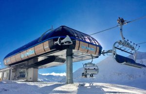 Mount Elbrus Ski Lift Accident Kills 2, Injures 9 Rescuers at Mount Elbrus base examine a stopped ski lift cabin after the fatal cable failure.