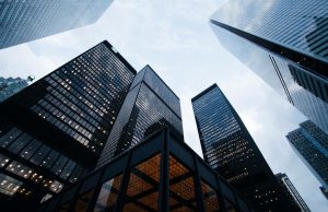 Deutsche Bank Slips to Sixth in German Market Deutsche Bank headquarters in Frankfurt with German corporate logos in the background