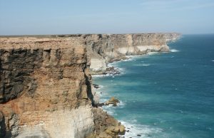 Equinor Cancels Great Australian Bight Oil Drilling Aerial view of the Great Australian Bight coastline with turquoise waters and rugged cliffs.