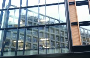 Google DeepMind Merges with Google Brain Division Google DeepMind logo displayed on a modern office building in London, symbolizing the AI research lab's headquarters and its merger with Google Brain.
