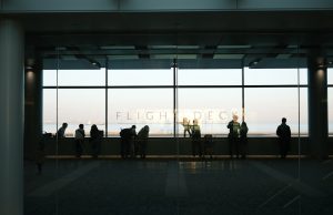 Philippines Repatriates 314 Tourists to Wuhan Chinese tourists boarding a repatriation flight at a Philippine airport amid health screening protocols.