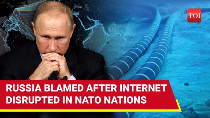 Putin Internet Censorship Infrastructure Failure Moscow apartment blocks at dusk, laptop screens show spinning load wheels over Facebook and Twitter logos.