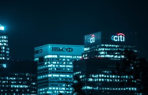HSBC Faces China Blacklist After Huawei Files Handover HSBC branch in Shanghai with security shutters half-closed, symbolizing looming Chinese sanctions.